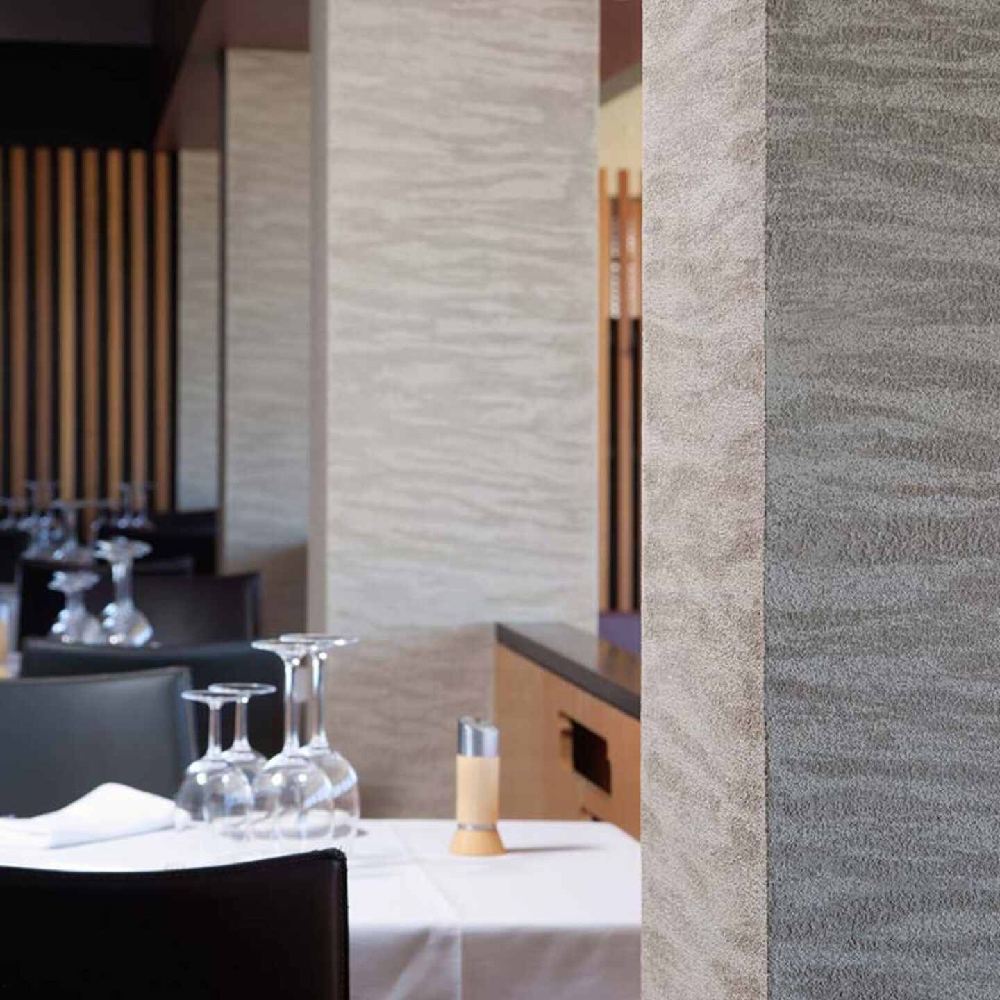 Detail of wall pillar in restaurant with horizontal pattern, using Armourcoat Travertine Polished Plaster