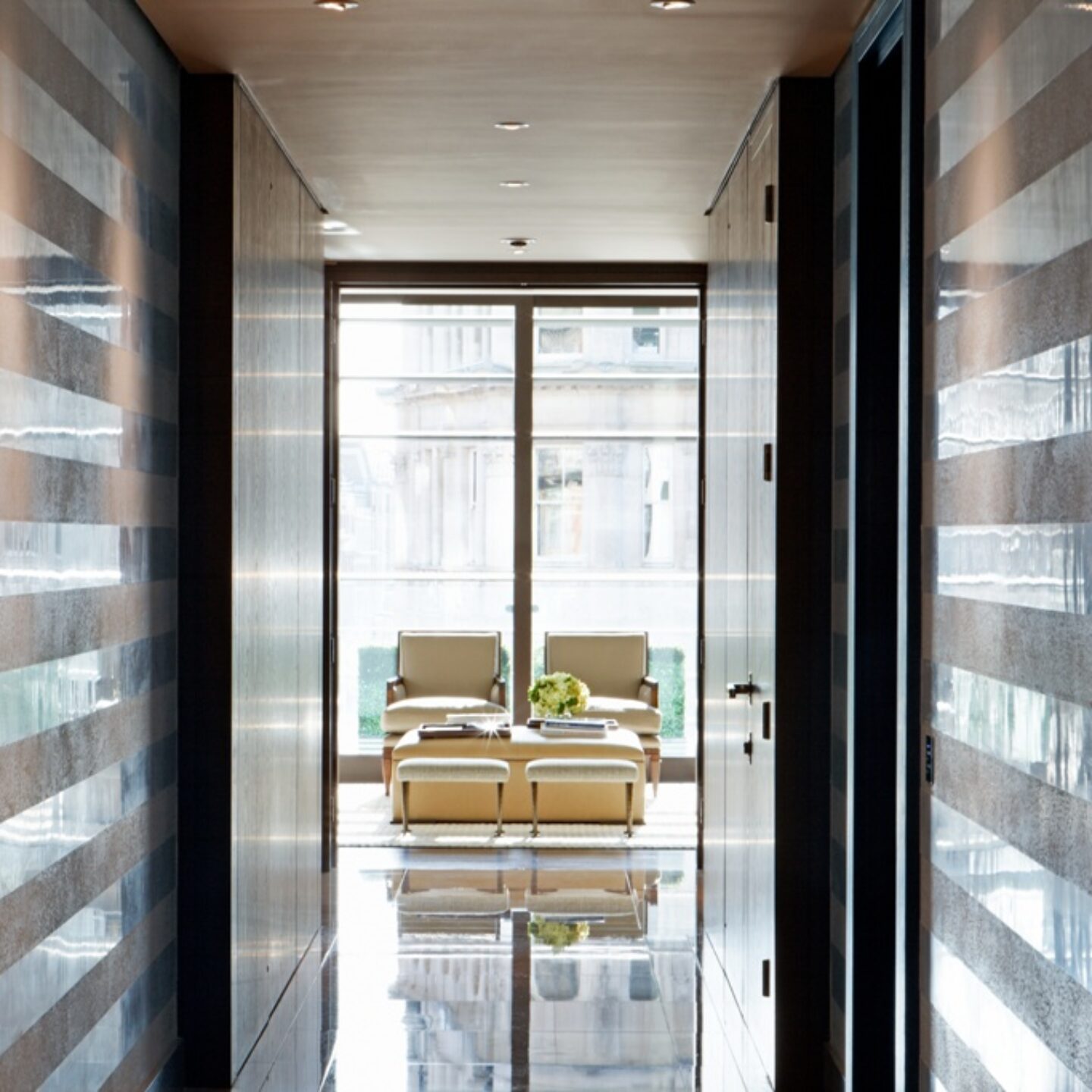 Armourcoat Spatulata polished plaster finish applied using banding technique to walls of luxury residential location